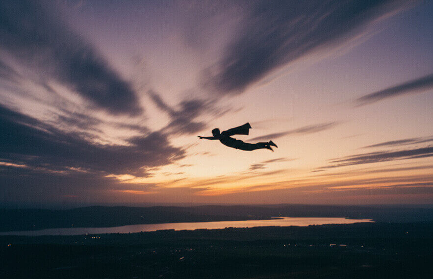 A silhouette of a man flying